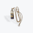 Load image into Gallery viewer, Slum Gold Glass 40 Oz Bottle Pendant w/ Gold Chain - front view
